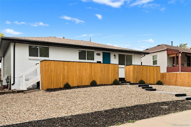 single story home with fence