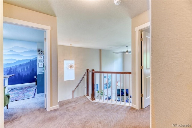 2347 S Loveland St, Lakewood, CO 80228 - hall featuring an upstairs landing, carpet, and a chandelier