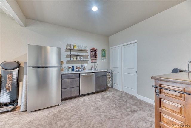 2347 S Loveland St, Lakewood, CO 80228 - kitchen featuring appliances with stainless steel finishes, light carpet, a sink, open shelves, and gray cabinetry
