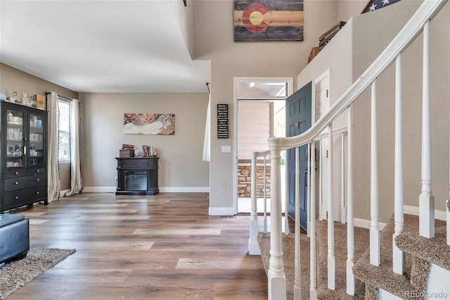 10695 Wynspire Rd, Highlands Ranch, CO 80130 - entrance foyer featuring stairway, wood finished floors, and baseboards