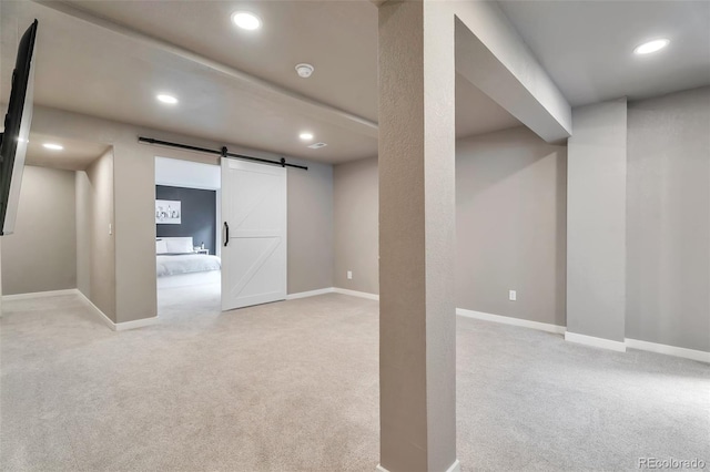 10695 Wynspire Rd, Highlands Ranch, CO 80130 - below grade area with carpet, a barn door, recessed lighting, and baseboards