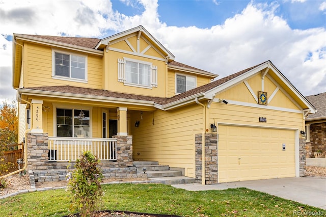 craftsman house with a porch and a garage