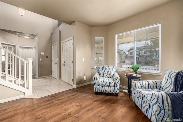 sitting room with wood-type flooring