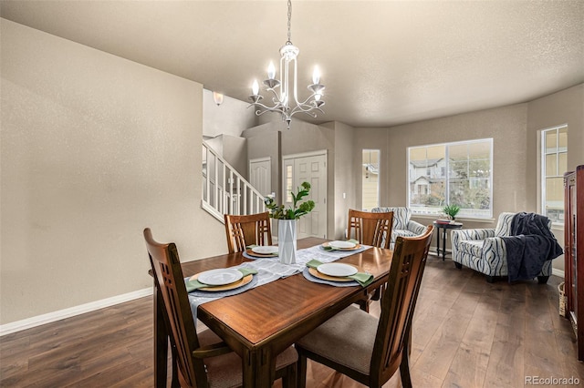 dining room featuring dark hardwood / wood-style flooring and a notable chandelier