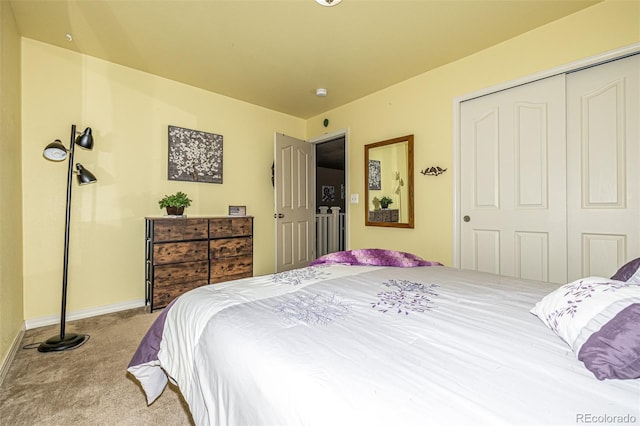 carpeted bedroom featuring a closet