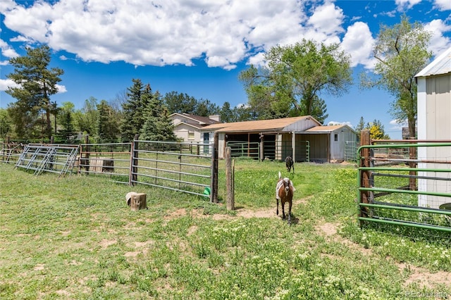 10220 W Montgomery Ave, Littleton, CO 80127 - view of yard featuring an exterior structure and an outbuilding