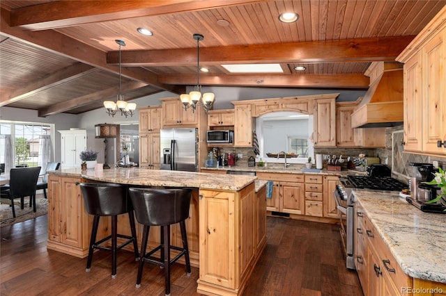 10220 W Montgomery Ave, Littleton, CO 80127 - kitchen featuring stainless steel appliances, light brown cabinetry, a center island, a chandelier, and dark wood-style floors