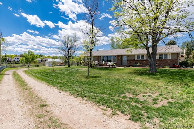 10220 W Montgomery Ave, Littleton, CO 80127 - ranch-style house featuring brick siding and dirt driveway