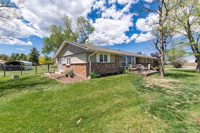 10220 W Montgomery Ave, Littleton, CO 80127 - back of property with brick siding and a patio