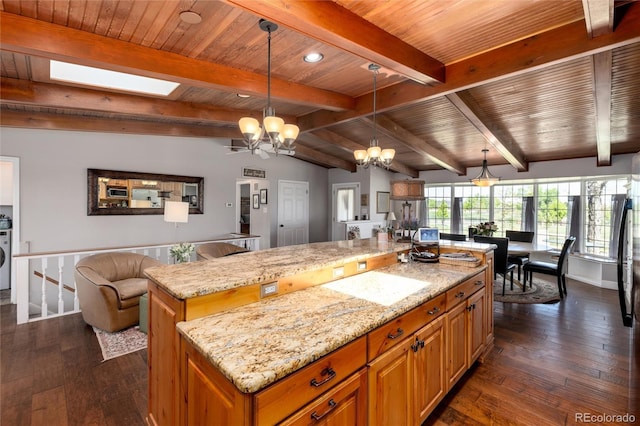 10220 W Montgomery Ave, Littleton, CO 80127 - kitchen featuring a chandelier, a center island, dark wood-type flooring, light stone countertops, and wooden ceiling