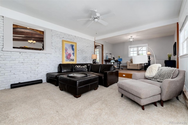 10220 W Montgomery Ave, Littleton, CO 80127 - living room with carpet, brick wall, and a ceiling fan