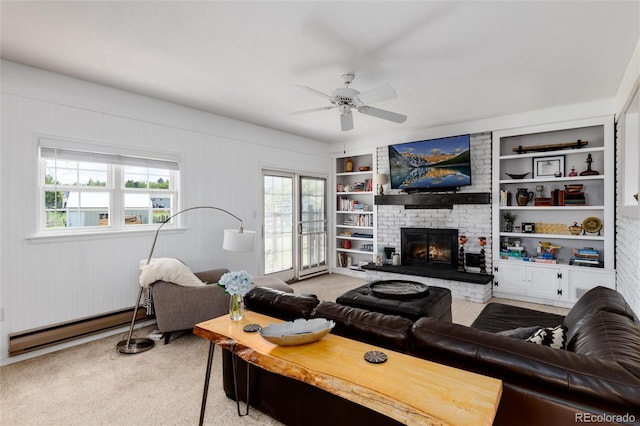 10220 W Montgomery Ave, Littleton, CO 80127 - living room featuring light carpet, baseboard heating, a fireplace, a ceiling fan, and built in features