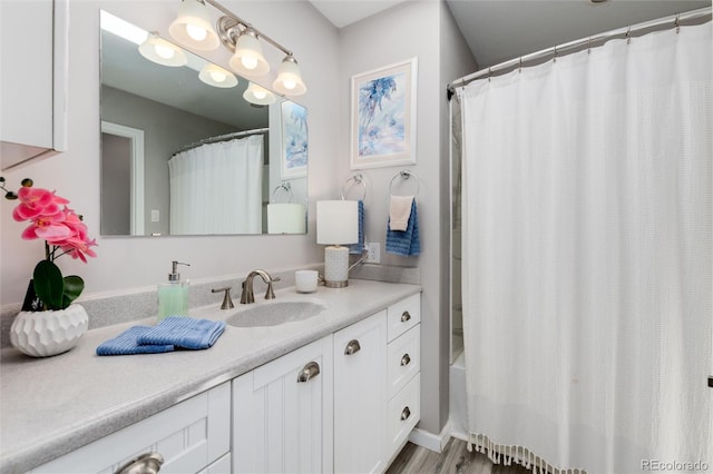 10220 W Montgomery Ave, Littleton, CO 80127 - bathroom with vanity and shower / tub combo with curtain