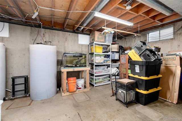 10220 W Montgomery Ave, Littleton, CO 80127 - unfinished below grade area featuring water heater and washer / clothes dryer