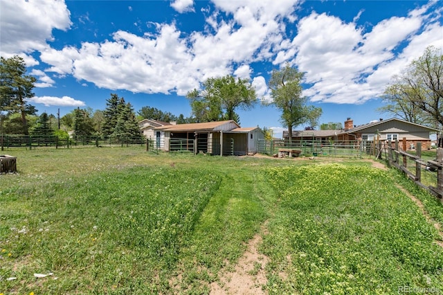 10220 W Montgomery Ave, Littleton, CO 80127 - view of yard featuring an exterior structure and an outdoor structure