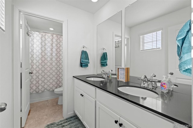 full bathroom with toilet, vanity, shower / tub combo, and tile patterned flooring