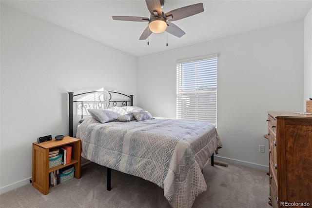 bedroom with light carpet and ceiling fan