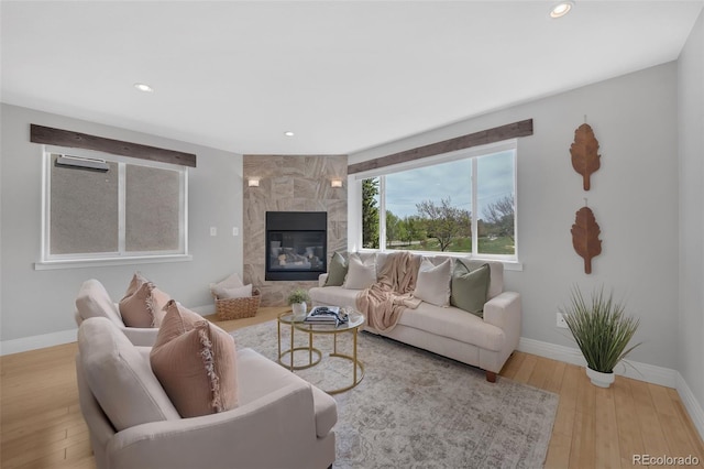 2539 N York St, Denver, CO 80205 - living area with baseboards, wood finished floors, a premium fireplace, and recessed lighting