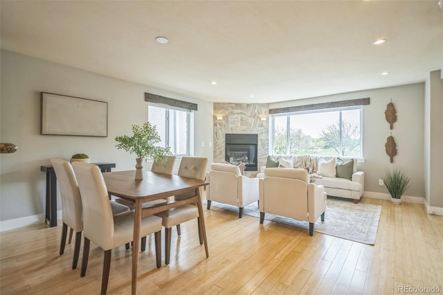 2539 N York St, Denver, CO 80205 - dining area featuring light wood finished floors, a fireplace, baseboards, and recessed lighting