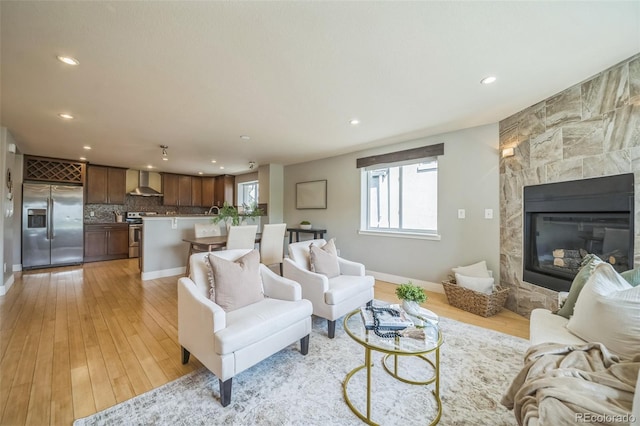 2539 N York St, Denver, CO 80205 - living area featuring recessed lighting, light wood-style flooring, baseboards, and a tile fireplace