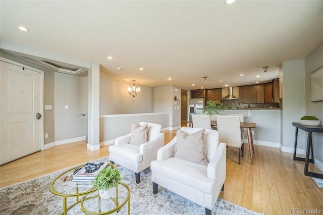 2539 N York St, Denver, CO 80205 - living area featuring recessed lighting, light wood-style floors, baseboards, and a chandelier