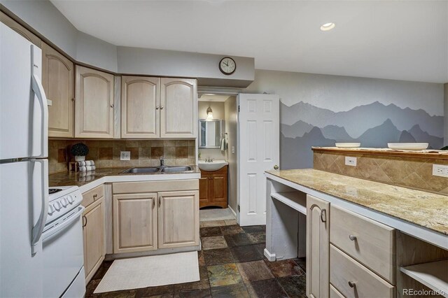 891 Fairview Blvd Unit 20, Breckenridge, CO 80424 - kitchen featuring light brown cabinetry, white appliances, backsplash, stone tile floors, and recessed lighting