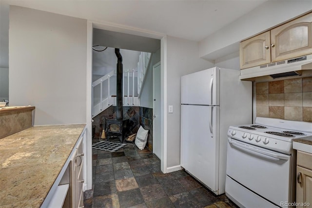 891 Fairview Blvd Unit 20, Breckenridge, CO 80424 - kitchen with white range with electric stovetop, under cabinet range hood, tasteful backsplash, light countertops, and a wood stove