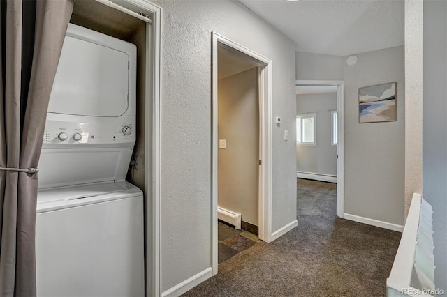 891 Fairview Blvd Unit 20, Breckenridge, CO 80424 - washroom featuring stacked washing machine and dryer, carpet floors, a baseboard heating unit, and a textured wall
