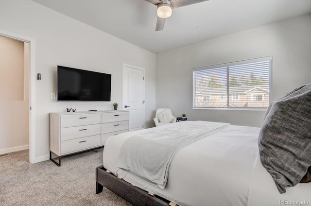 bedroom featuring ceiling fan and light carpet