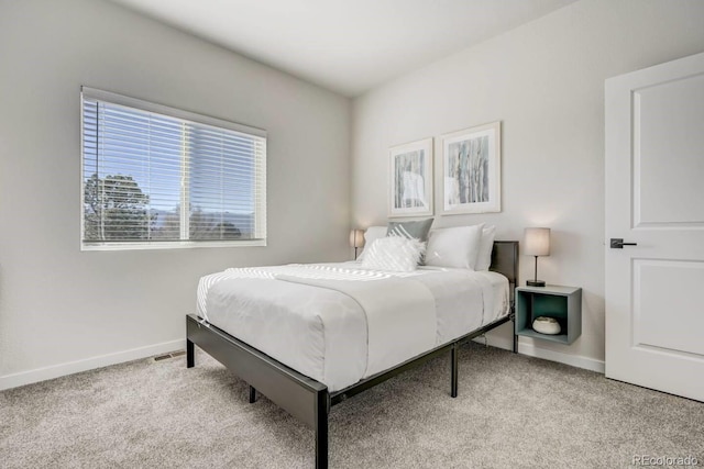 bedroom with light carpet