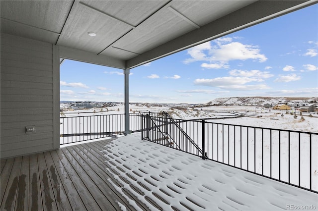 view of snow covered deck