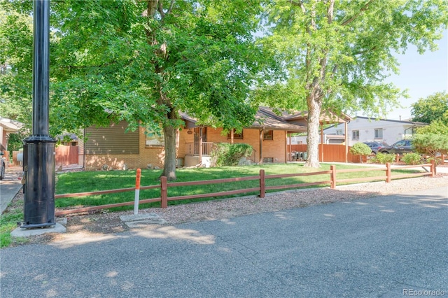 3230 Balsam St, Wheat Ridge, CO 80033 - view of front facade featuring brick siding