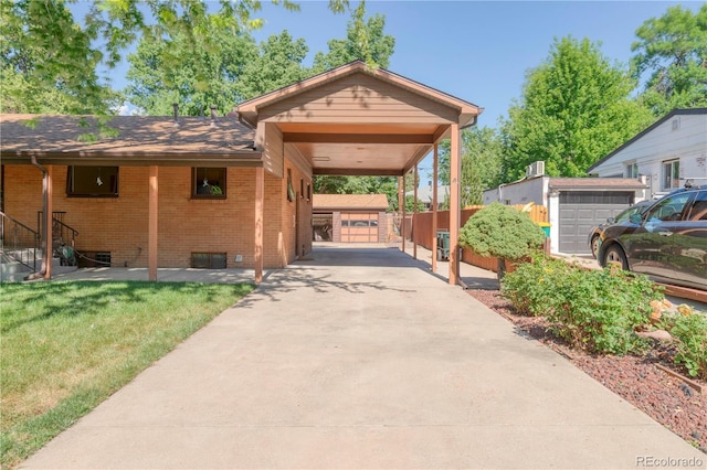 3230 Balsam St, Wheat Ridge, CO 80033 - view of parking / parking lot with driveway and a carport
