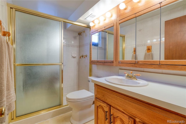 3230 Balsam St, Wheat Ridge, CO 80033 - full bathroom with vanity, a tile shower, and tile walls