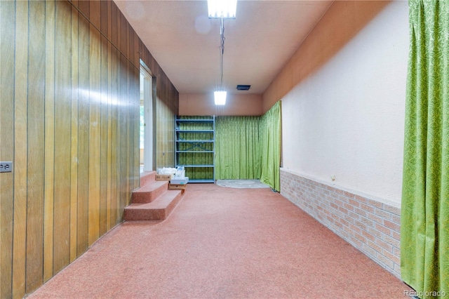 3230 Balsam St, Wheat Ridge, CO 80033 - below grade area featuring carpet and wood walls