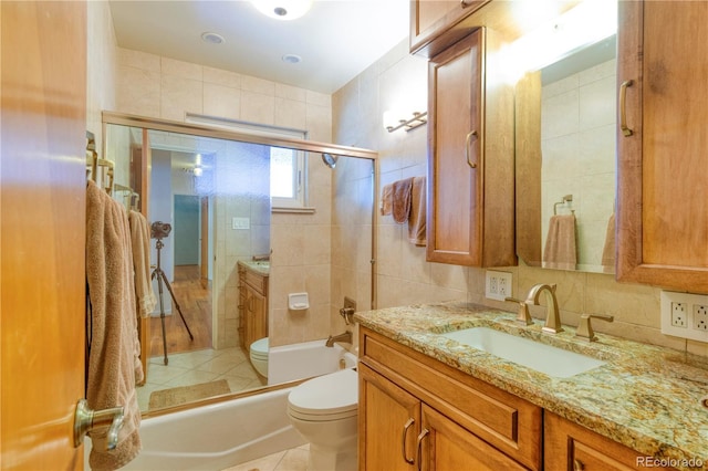 3230 Balsam St, Wheat Ridge, CO 80033 - bathroom featuring vanity, an enclosed shower, tile walls, and backsplash