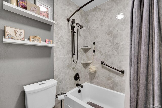 full bathroom featuring shower / bath combo and toilet