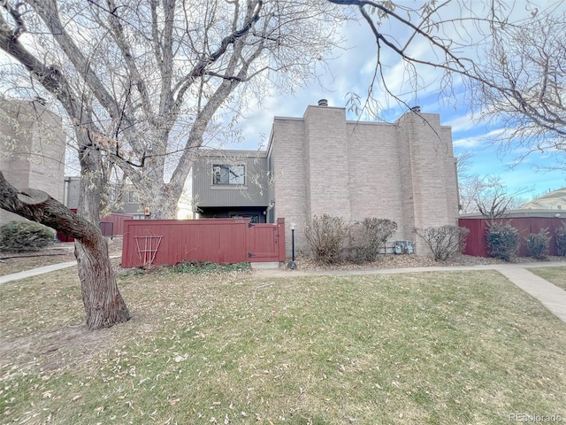 view of property exterior with a yard