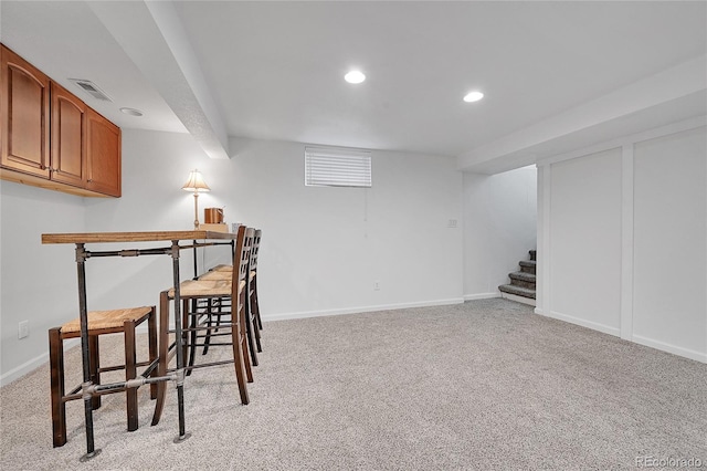 interior space featuring light colored carpet