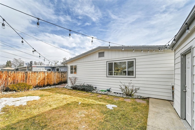 view of property exterior featuring a lawn