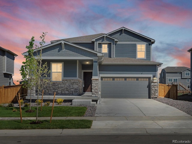 17487 E 89th Way, Commerce City, CO 80022 - craftsman inspired home featuring concrete driveway, stone siding, and a garage