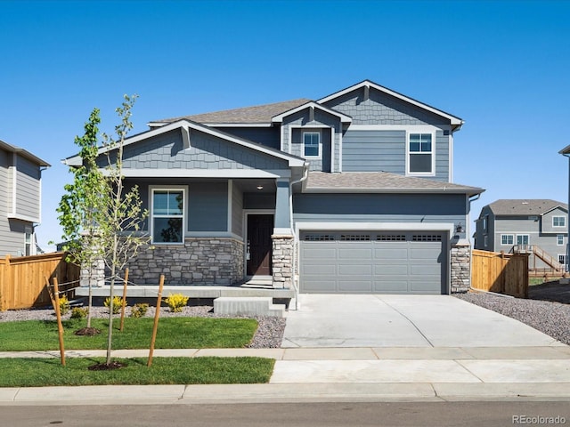 17487 E 89th Way, Commerce City, CO 80022 - craftsman house with an attached garage, concrete driveway, stone siding, and a shingled roof