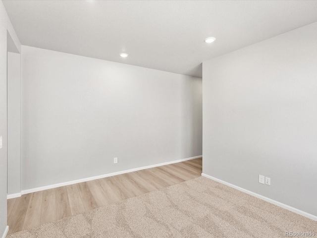 17487 E 89th Way, Commerce City, CO 80022 - spare room featuring baseboards, recessed lighting, and wood finished floors