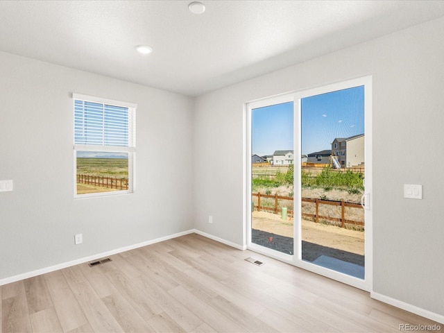 17487 E 89th Way, Commerce City, CO 80022 - spare room with wood finished floors and baseboards