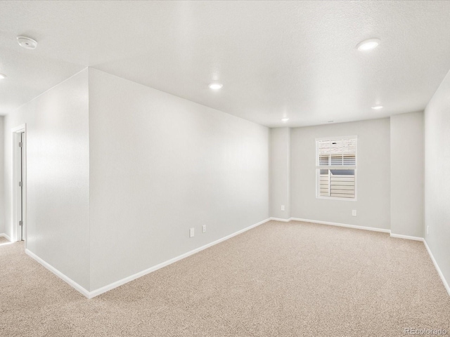 17487 E 89th Way, Commerce City, CO 80022 - empty room with light colored carpet, recessed lighting, a smoke detector, and baseboards