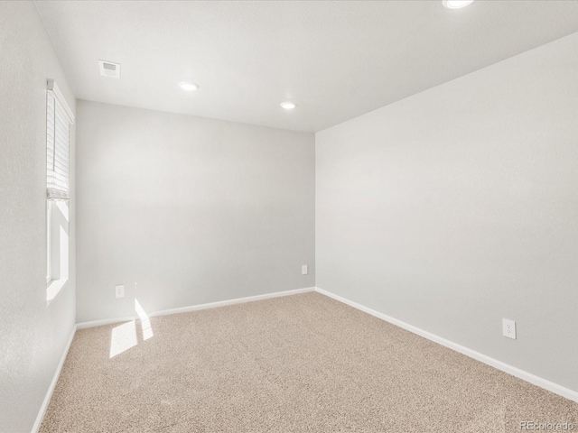 17487 E 89th Way, Commerce City, CO 80022 - carpeted spare room featuring plenty of natural light, baseboards, and recessed lighting