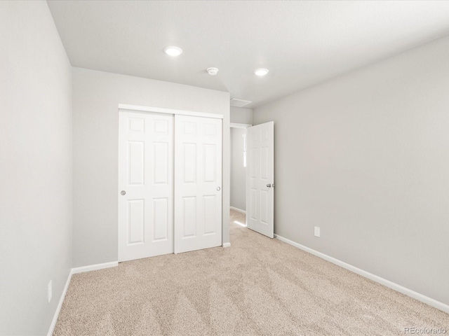 17487 E 89th Way, Commerce City, CO 80022 - unfurnished bedroom with carpet flooring, baseboards, a closet, and recessed lighting