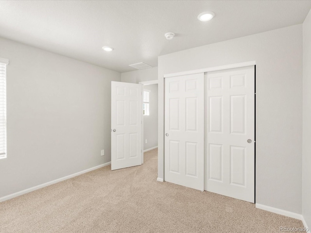 17487 E 89th Way, Commerce City, CO 80022 - unfurnished bedroom featuring light carpet, baseboards, a closet, and recessed lighting