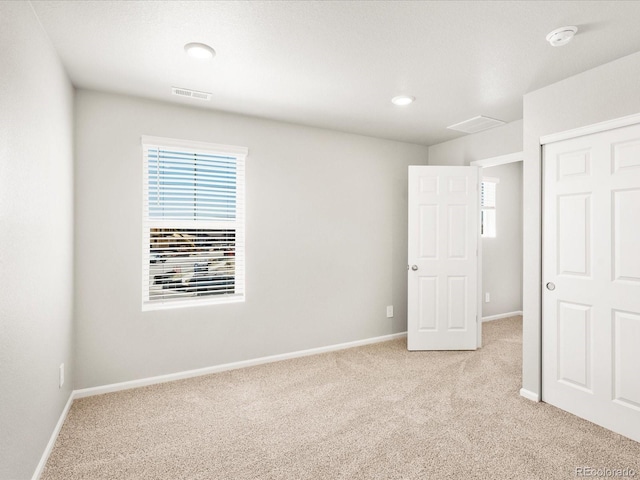 17487 E 89th Way, Commerce City, CO 80022 - unfurnished bedroom with light carpet, multiple windows, and baseboards