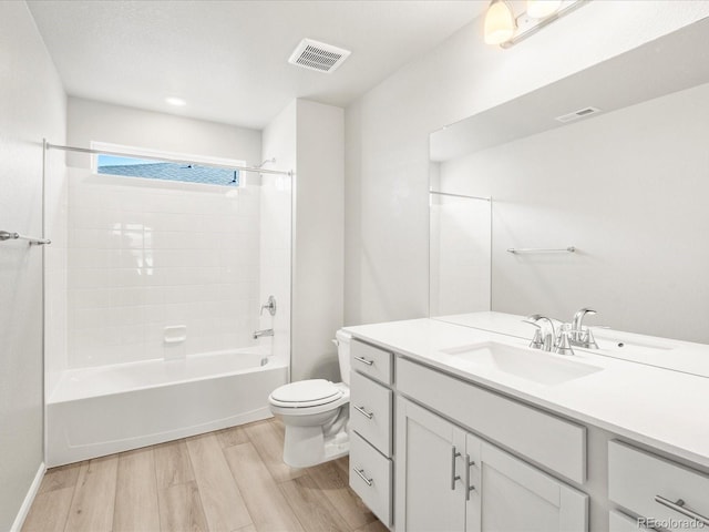 17487 E 89th Way, Commerce City, CO 80022 - bathroom featuring vanity, toilet, wood finished floors, and shower / tub combination